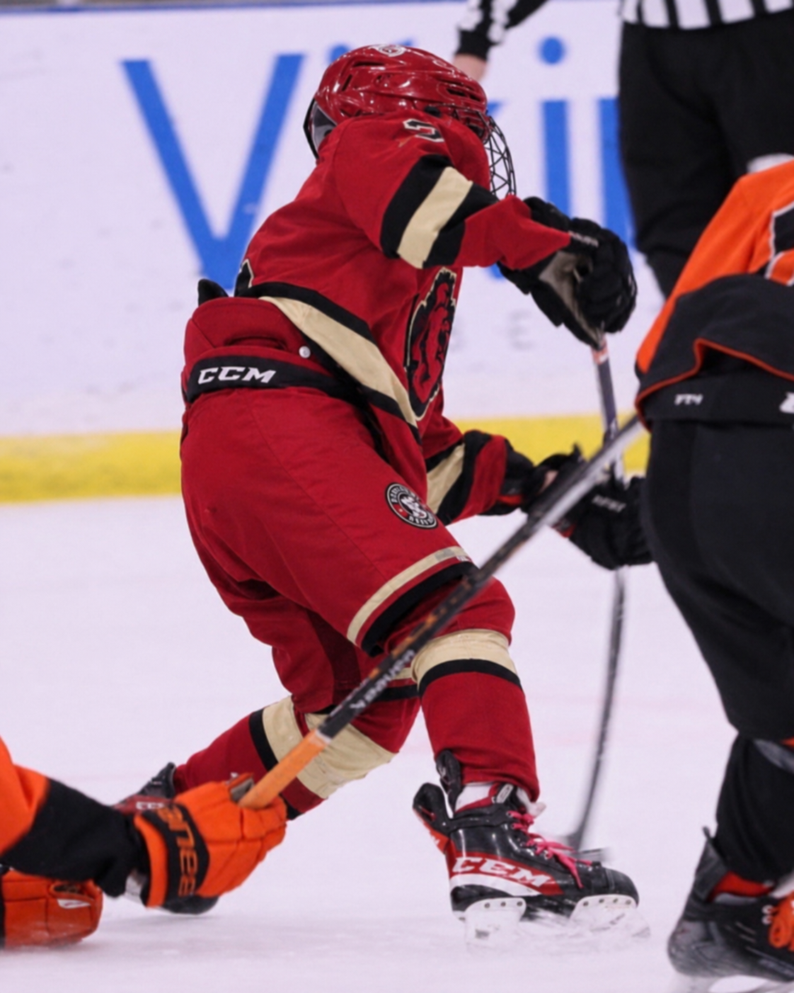 Bow Valley Jr. Bigfoot player battling for the puck